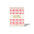 Personalised 2027 desk calendar with custom name, pink gingham pattern, delicate floral illustrations, and decorative dotted border.