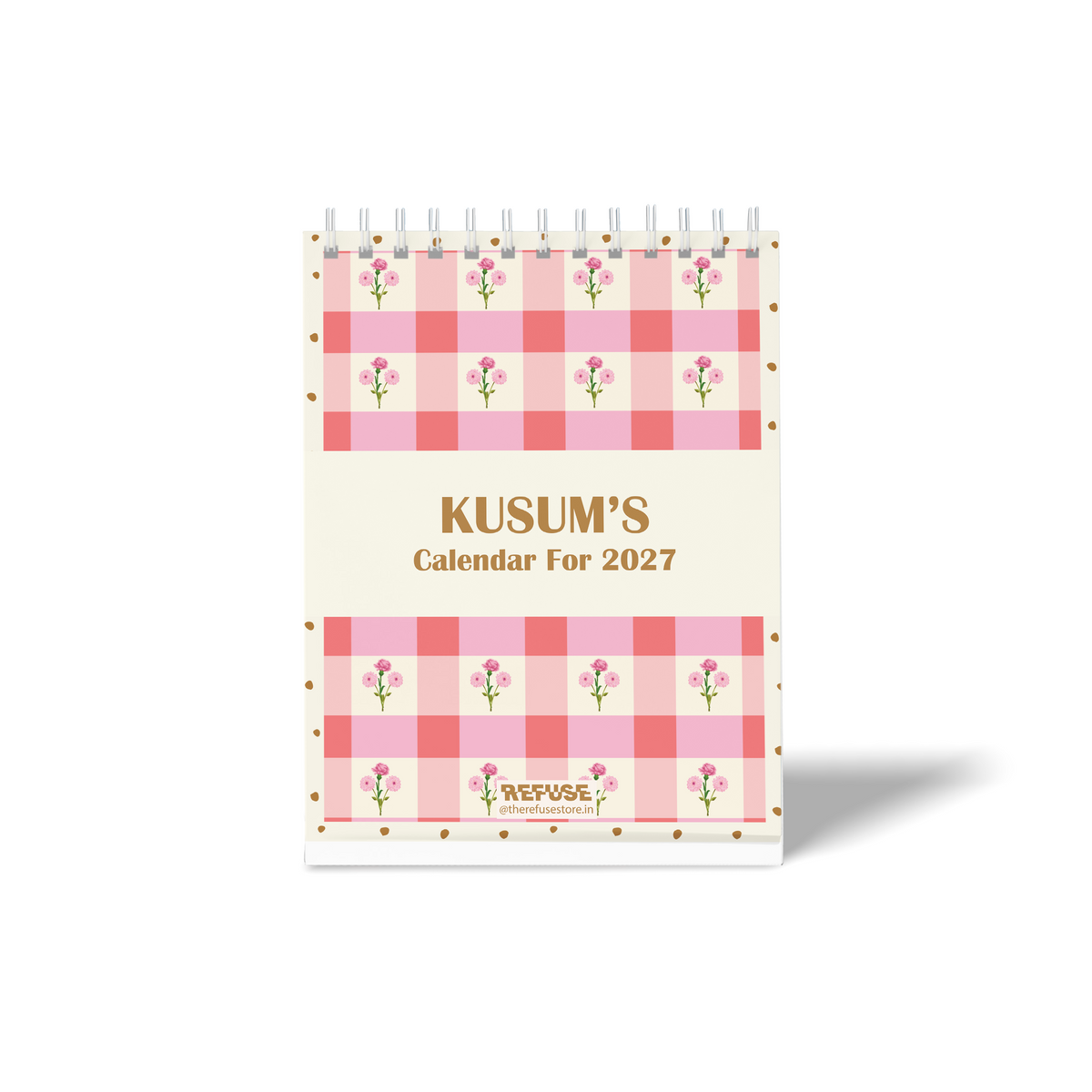 Personalised 2027 desk calendar with custom name, pink gingham pattern, delicate floral illustrations, and decorative dotted border.