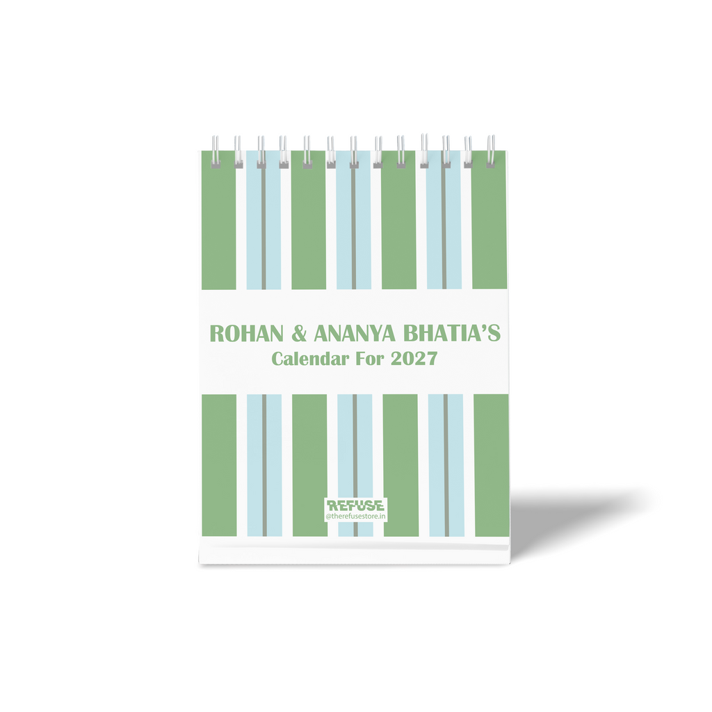 Personalised 2027 desk calendar with custom names, green and blue vertical stripe design, and clean minimalist layout.