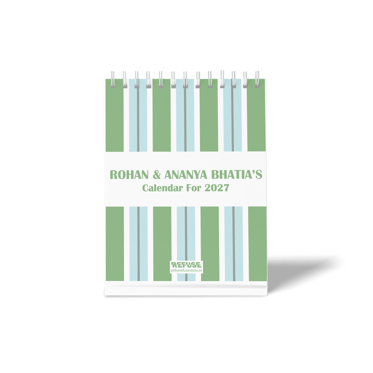 Personalised 2027 desk calendar with custom names, green and blue vertical stripe design, and clean minimalist layout.
