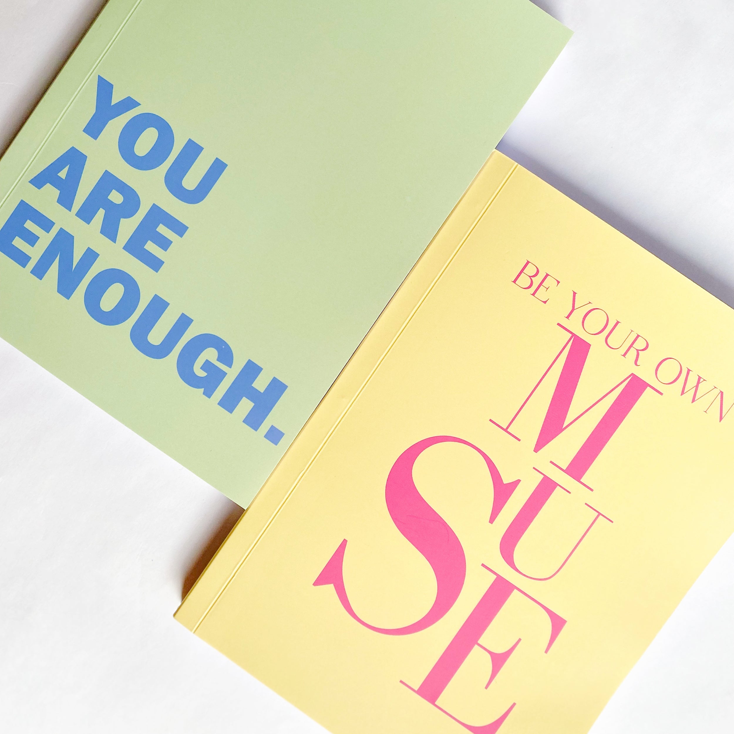 Colourful notebooks with motivational quotes