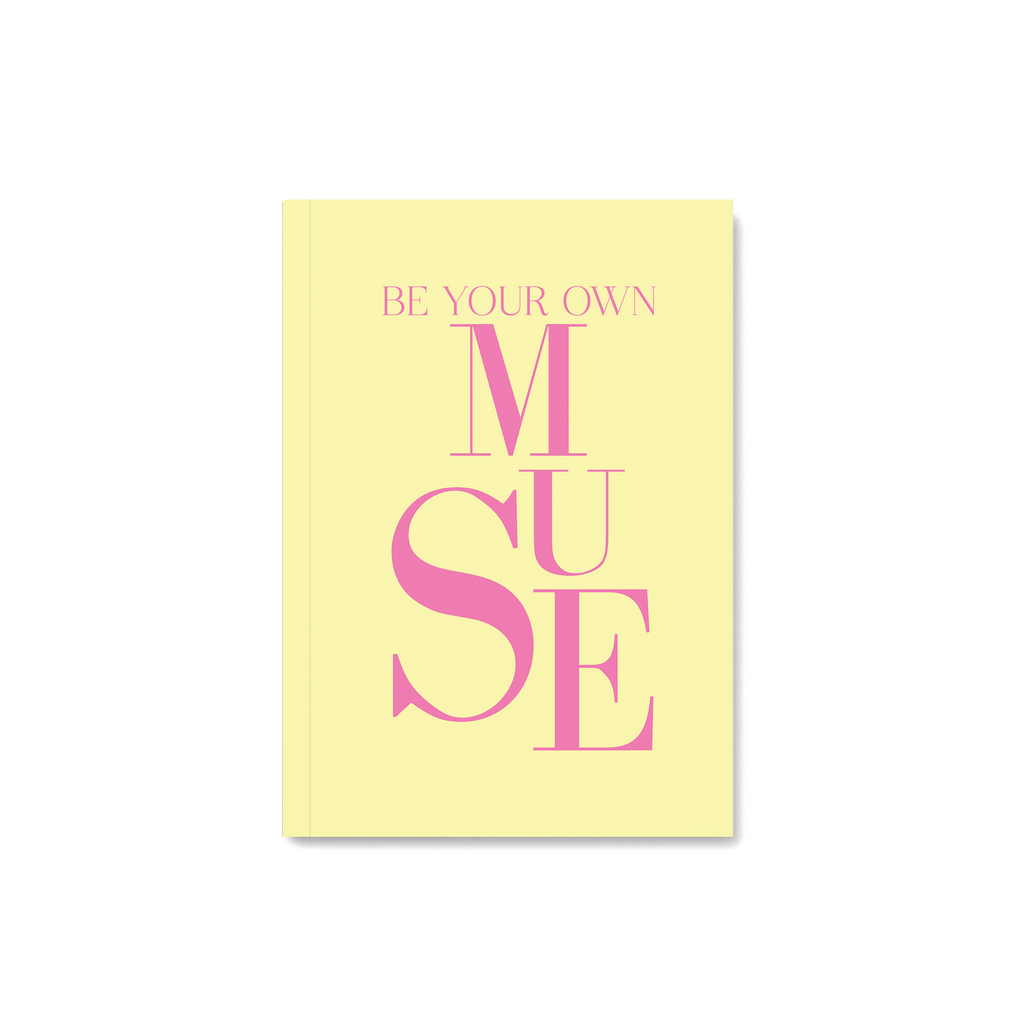 Yellow notebook with quoate be your own muse in pink