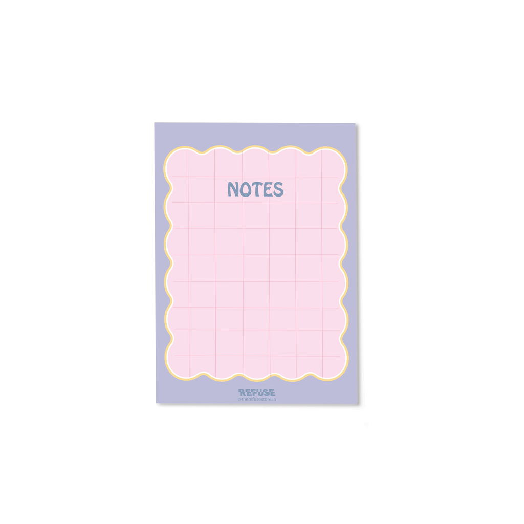 Pastel pink Notes notepad with a decorative scalloped border and grid layout for writing and organising ideas.