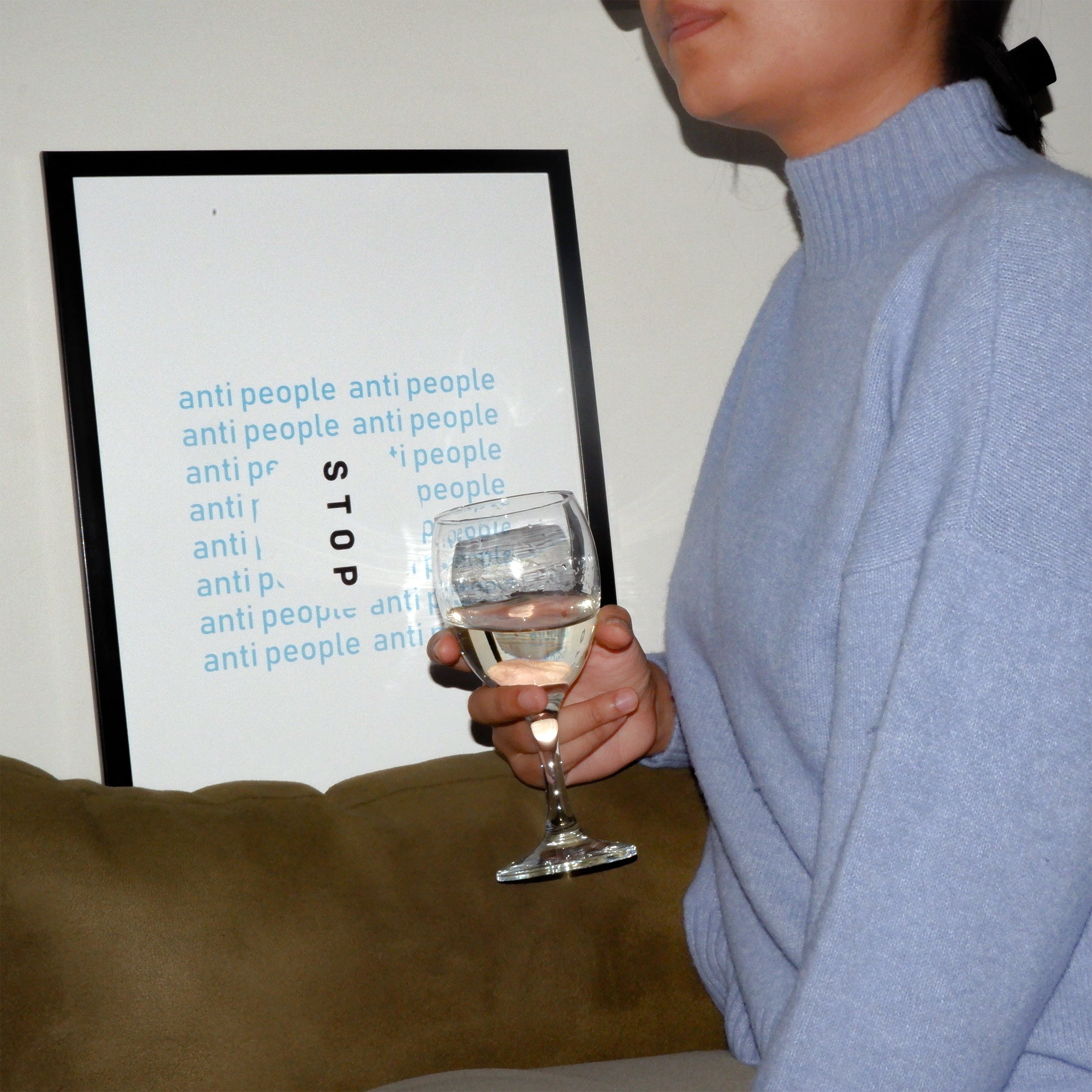 girl holding a glass & standing infront of Anti People Poster framed A3 size 