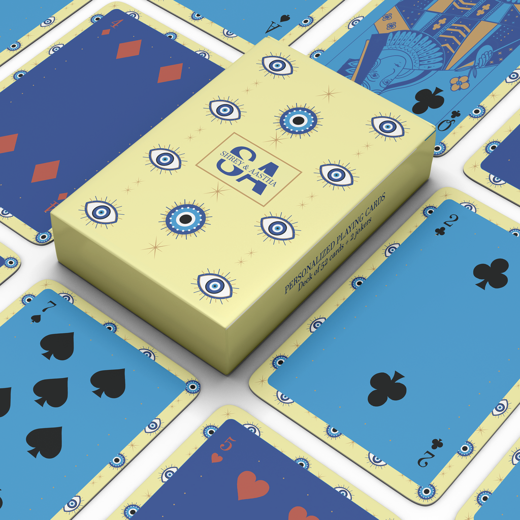 Personalised playing card set with yellow & blue evil eye playing card designs.