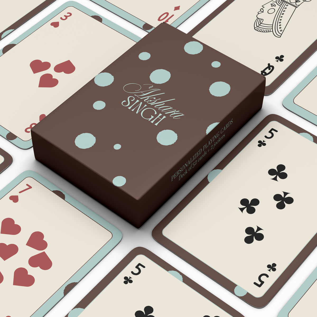 Personalised playing card set with a brown and blue polka-dot box, including a deck of 52 cards and 2 jokers.