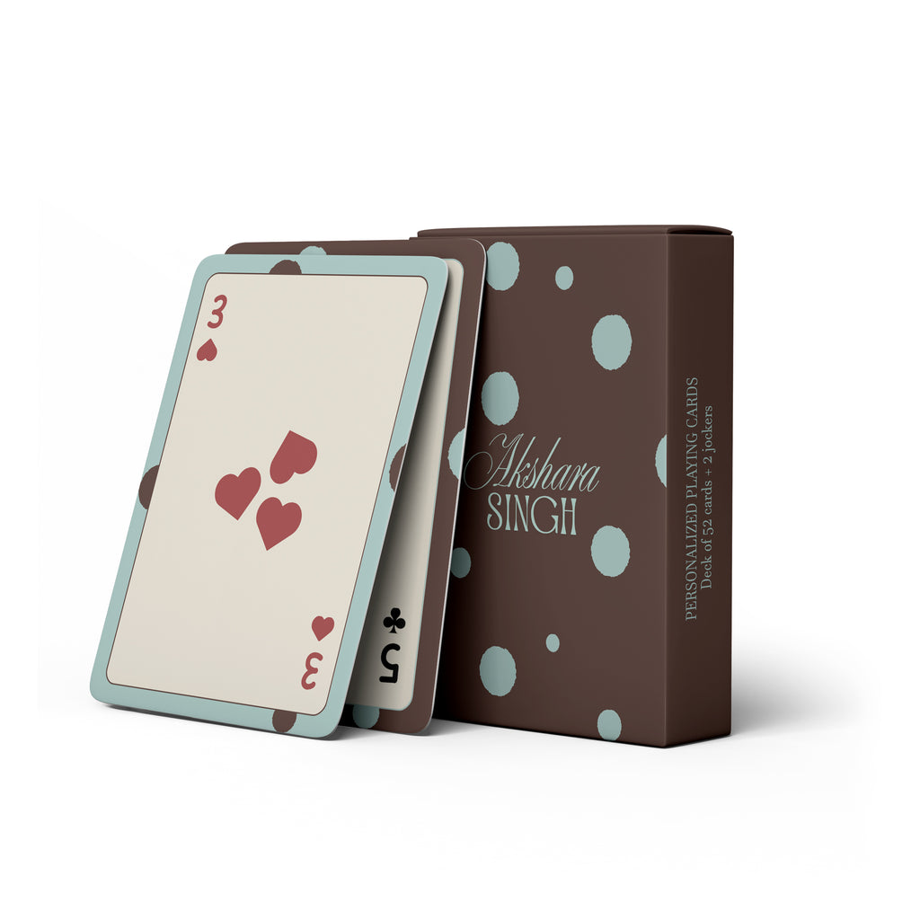 Personalised playing card set with a brown and teal polka-dot box, including a deck of 52 cards and 2 jokers.