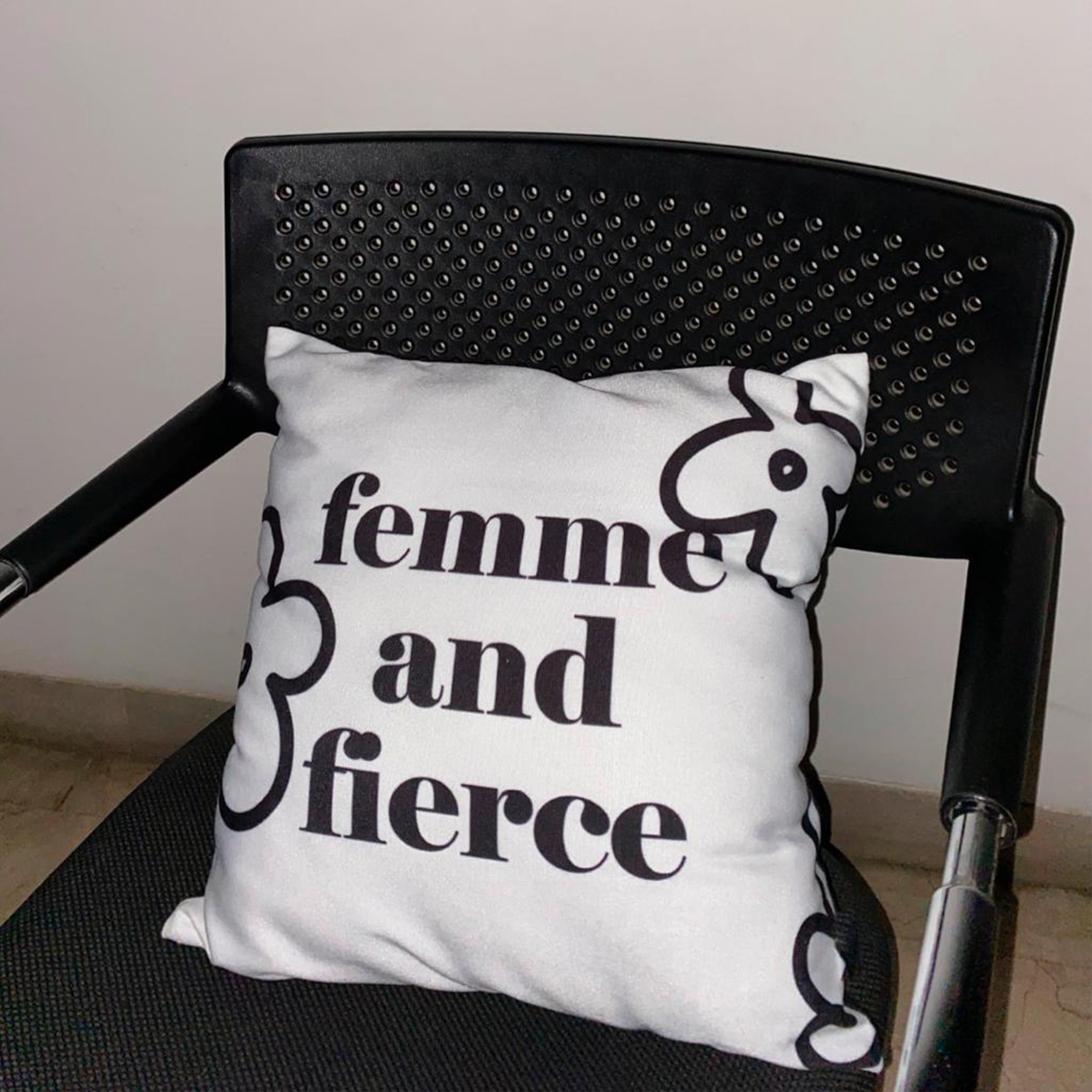 Femme And Fierce Cushion Cover on a chair