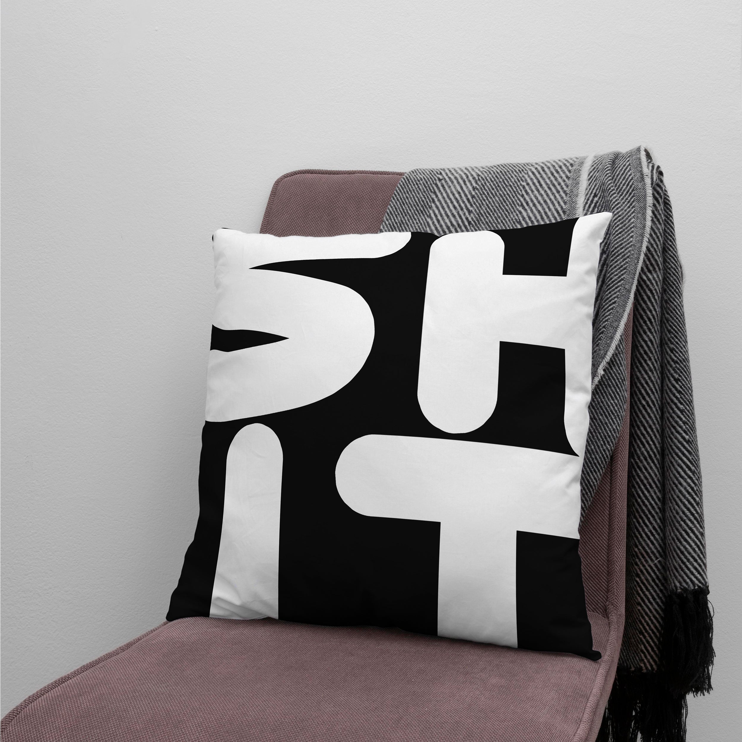 SHIT Cushion Cover on a chair