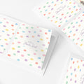 Pastel personalised stickers with colourful abstract dots and custom name text, shown arranged on a white background.