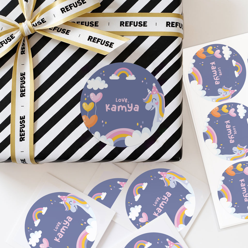 Personalised unicron theme stickers displayed on a wrapped gift, with colourful abstract dots and custom name text.
