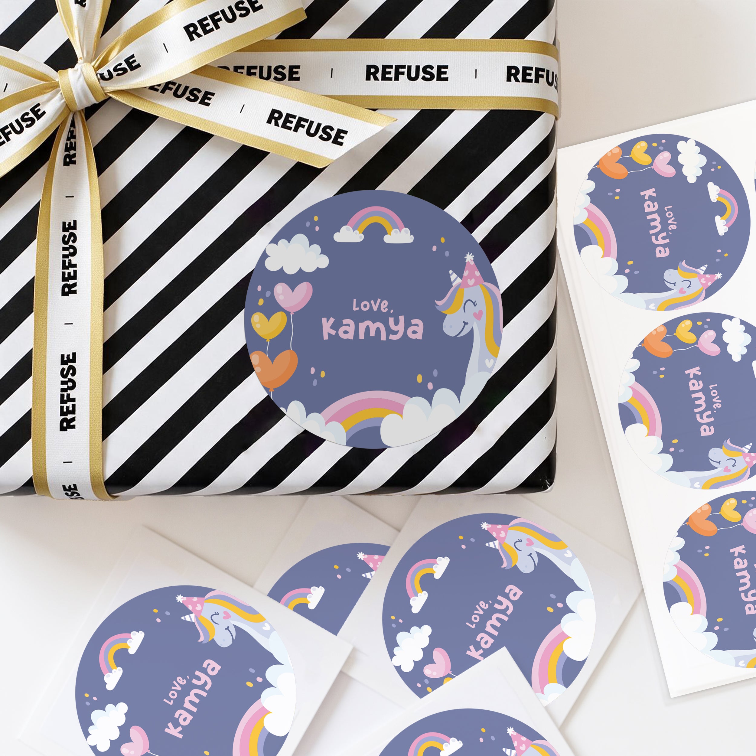 Personalised unicron theme stickers displayed on a wrapped gift, with colourful abstract dots and custom name text.
