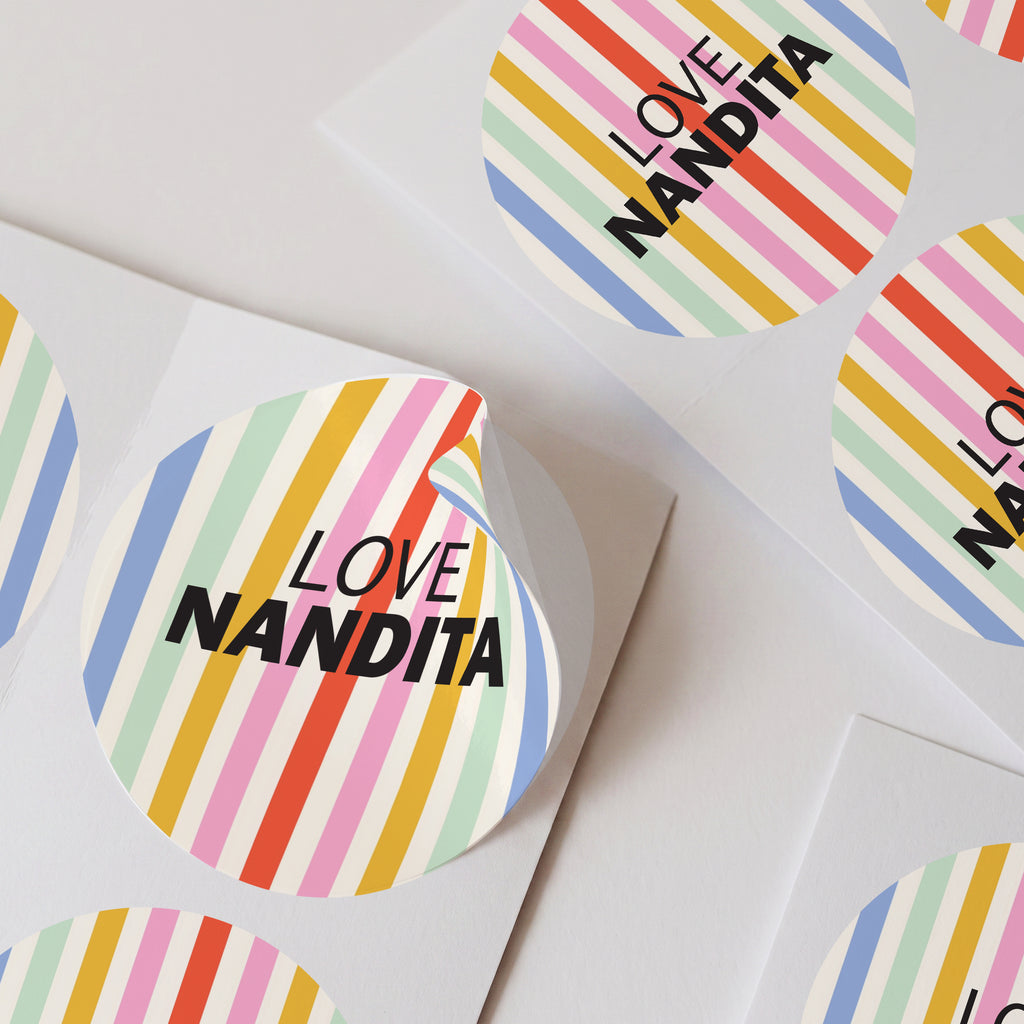 multi coloured striped personalised stickers with custom name text, shown arranged on a white background.