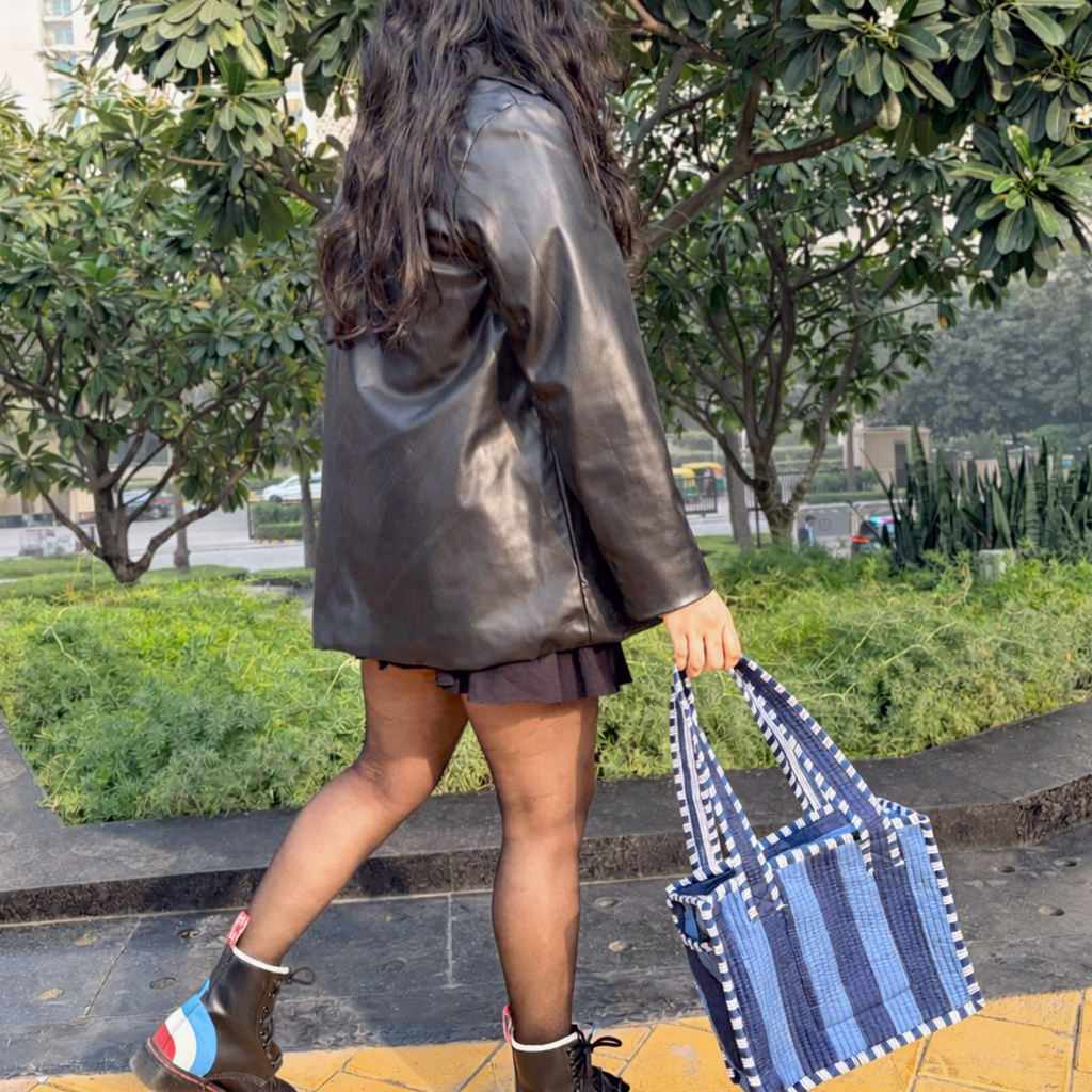 Girl holding Blue Bold Striped Quilted Mini Tote Bag