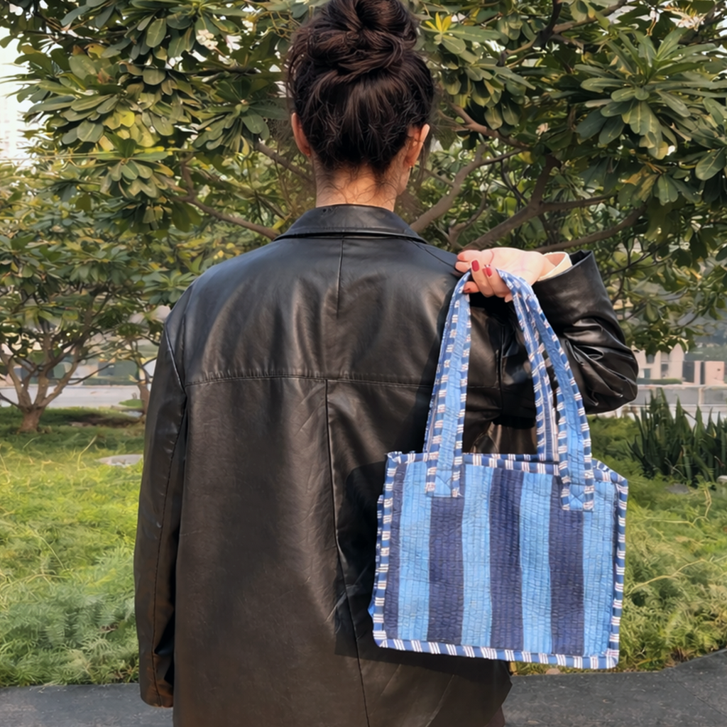 Girl holding Blue Bold Striped Quilted Mini Tote Bag