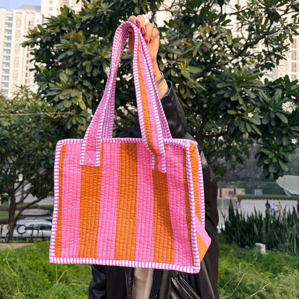 Girl holding Pink & Rust Bold Striped Quilted Mini Tote Bag
